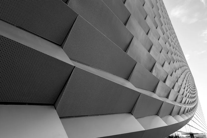 A modern building's distinctive facade in black and white.